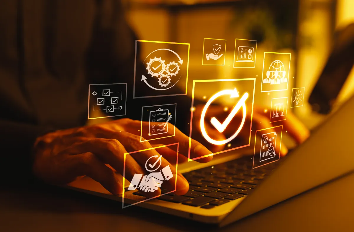 Hands on a laptop with floating digital security icons